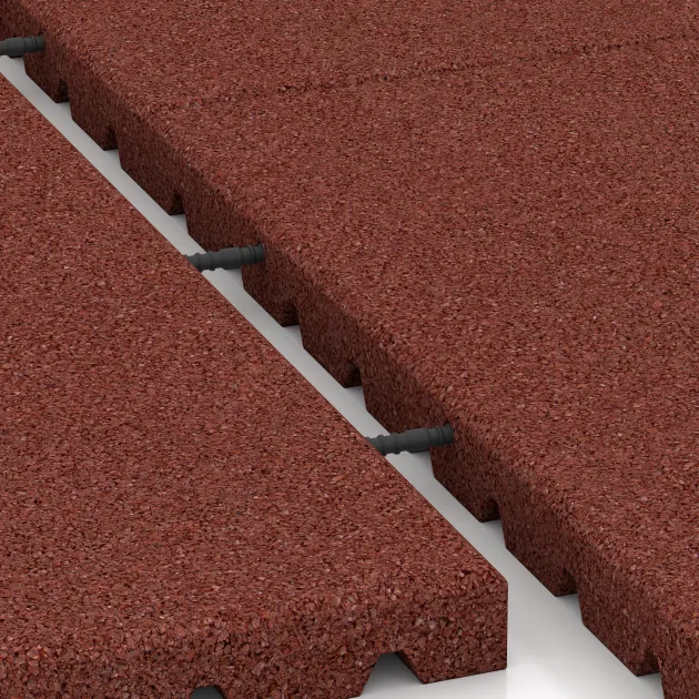 Großaufnahme vom Verbindungssystem von WARCO-Boden 5665 - Legepladsmåtte 4 cm - EN 1177 ≤ 110 cm im Farbdesign Murstenrød. Abmessungen 1000 x 1000 x 40 mm.