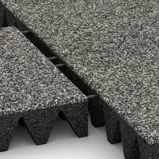 Großaufnahme vom Verbindungssystem von WARCO-Boden 5644 - Faldunderlag – gummiflise 10 cm - EN 1177 ≤ 300 cm im Farbdesign Grå Granit. Abmessungen 500 x 500 x 100 mm.