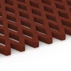 Großaufnahme vom Verbindungssystem von WARCO-Boden 7010 - Faldsikringsgræsrist im Farbdesign Murstenrød. Abmessungen 100 x 100 x 4 cm.